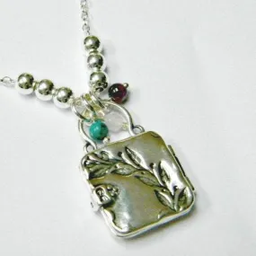 Sterling Silver necklace locket engraved with a beautiful branch with turquoise